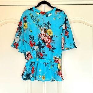 Aqua flowy top w bell sleeves, cold shoulder, and open back. Elastic at waist.